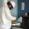 An EPA worker inspects a school lab